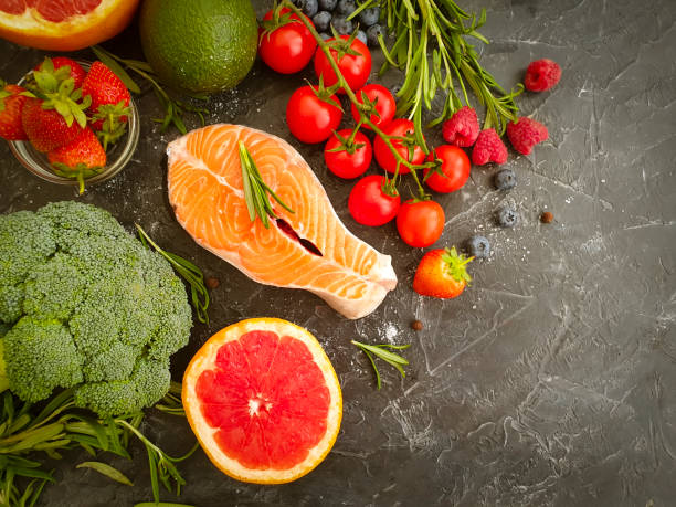 istock fresh salmon, tomato on concrete background dinner 1278302509