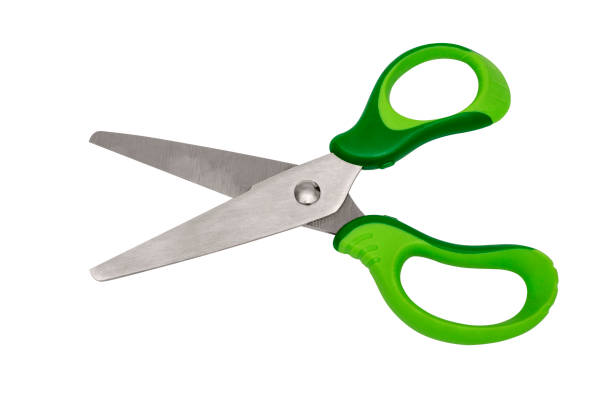 istock Green scissors isolated on white background. Scissors are hand-operated cutting instruments. Scissors are used for cutting various thin materials. Object is isolated on white background without shadows 1278302924