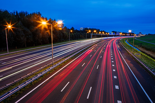 Car lights at night on the highway