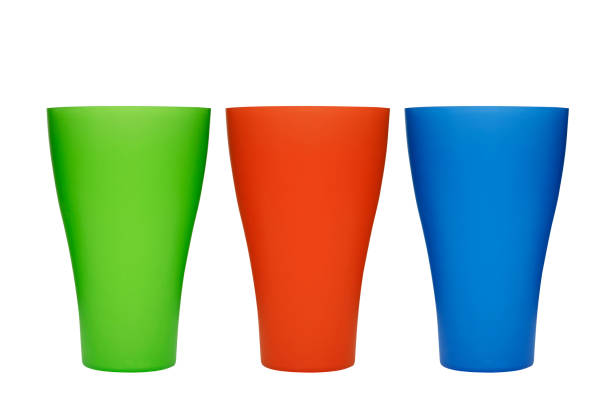 istock Three plastic multi-colored glasses isolated on a white background. Plastic glass of various color isolated on white background 1278311158