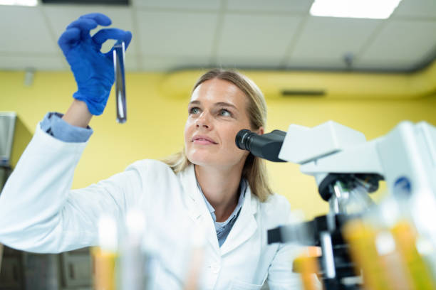 istock Young Female Scientist Working With Chemicals in Laboratory. 1278312049