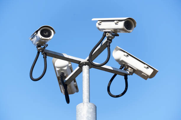 istock CCTV camera in sky watching people on street 1278313583