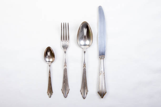istock silver cutlery on a white tablecloth, fork, knive and spoon 1278317991