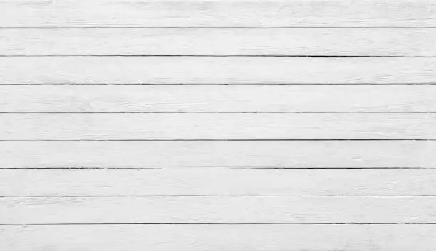 A surface of horizontal wooden boards painted white