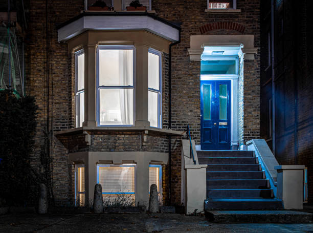 Blue house door in London suburb Blue house door in London suburb in the night, UK chiswick stock pictures, royalty-free photos & images