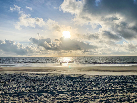 The sun rises above the Atlantic Ocean. Views from the shore of Tybee Island, Georgia offers a sense of peace and tranquility.