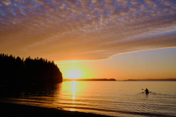 istock Sunset paddle.  Lone kayaker heads out to enjoy setting sun 1278324075