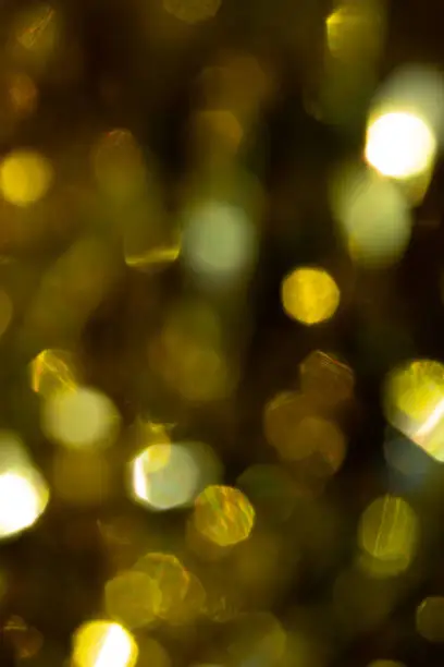 Photo of Abstract blurred gold background with beautiful bokeh effect.