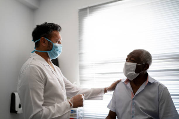 istock Doctor giving emotional support to a senior patient using face mask 1278325599