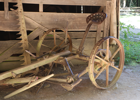 a piece of old farm equipment seen on a homestead in Cades Cove in Great Smoky Mountains National Park
