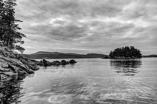 Black and white scenery on the coast of a small island in the Gulf Islands archipelago of British Columbia