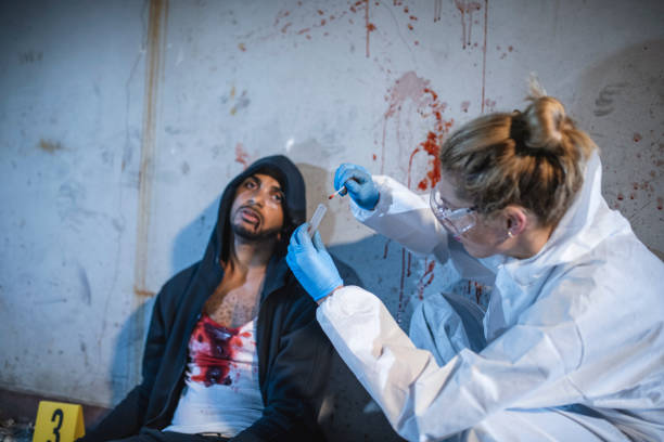 istock Collecting Murder Victim Blood Sample at Crime Scene 1278329848