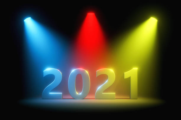 testo 2021 in faretti colorati, concetto di capodanno - single word lighting equipment illuminated photographic effects foto e immagini stock