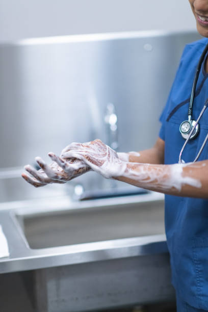 istock Doctor washing hands with soap 1278330232