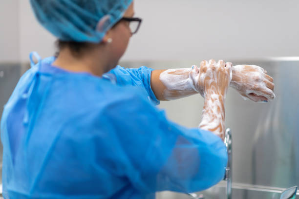 istock Doctor washing hands with soap 1278330250