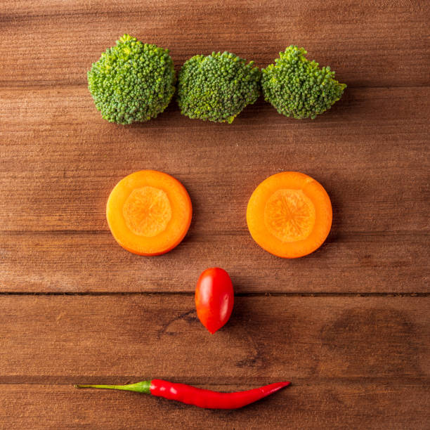 istock happy fresh organic vegetable and fruit face smiling 1278332829