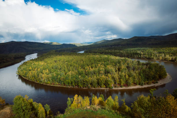 istock Beautiful autumn landscape with curving river and forest under blue sky 1278333235
