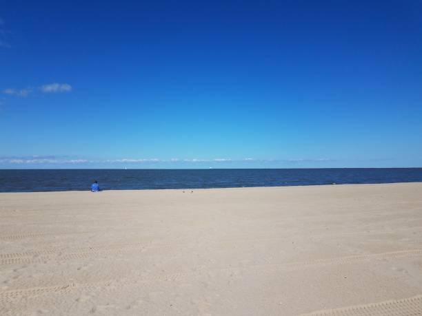 istock beach with tire tracks and ocean water and blue sky 1278337075