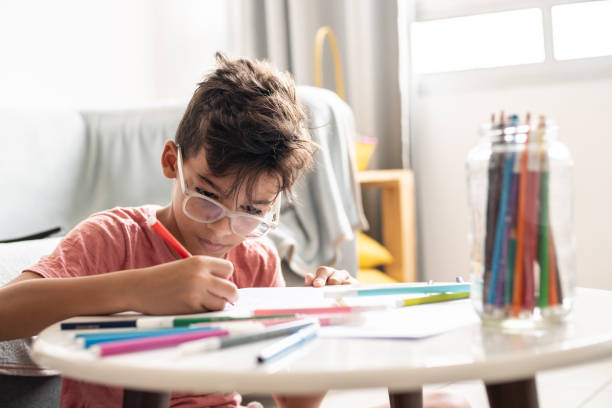 boy painting at home - child art childs drawing painted image imagens e fotografias de stock