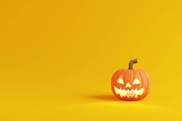 istock yellow background halloween pumpkin 1278338669