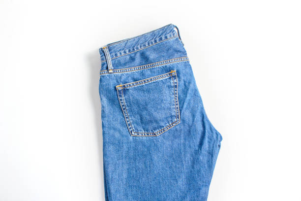 istock folded dark blue jeans on a white background. modern casual clothing. flat lay, top view 1278340248