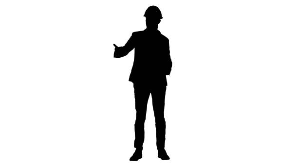 Silhouette Architect man in helmet and head set talking to camera and making gestures showing on some objects Full length shot. Silhouette Architect man in helmet and head set talking to camera and making gestures showing on some objects. Professional shot in 4K resolution. 011. You can use it e.g. in your commercial video, business, presentation, broadcast engineer silhouettes stock illustrations