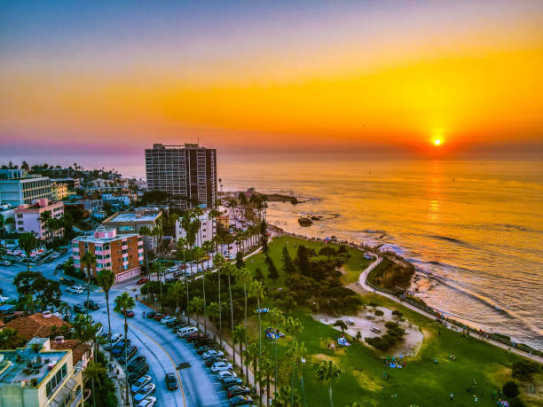 Sunset at La Jolla Cove This stunning contrast of colors is only possible with a beautiful sunset and giant ocean. san diego stock pictures, royalty-free photos & images