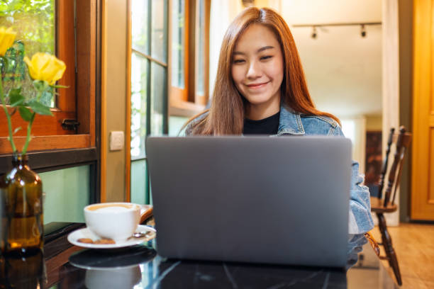 istock a beautiful young woman working and typing on laptop computer 1278354323