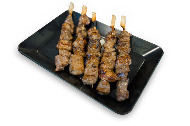 istock Die cut of Grilled beef on a grilled skewer on white isolated, focus selective. 1278358776