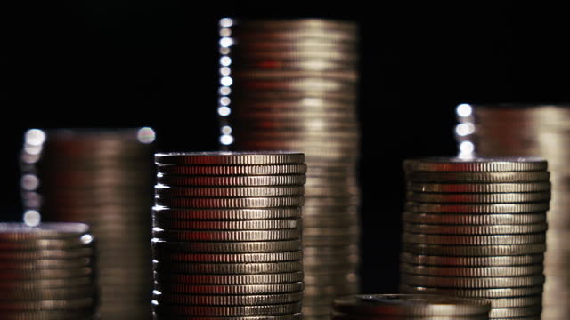 Close up shot of Coins stack on black background