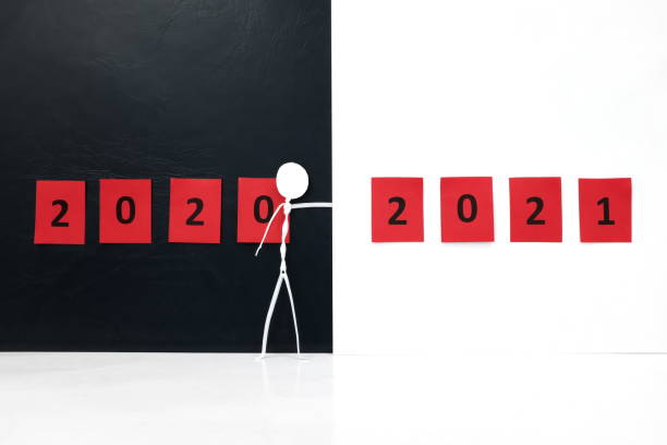 stick man figure changing 2020 year red poster to 2021 in black background with copy space. new year celebration concept. goodbye 2020 and hello 2021 - 0 1 year imagens e fotografias de stock