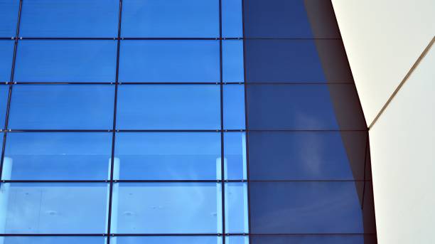 istock Abstract image of looking up at modern glass and concrete building. 1278363463