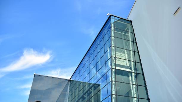 istock Abstract image of looking up at modern glass and concrete building. 1278363474