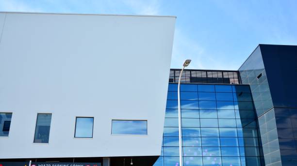 istock Abstract image of looking up at modern glass and concrete building. 1278363504