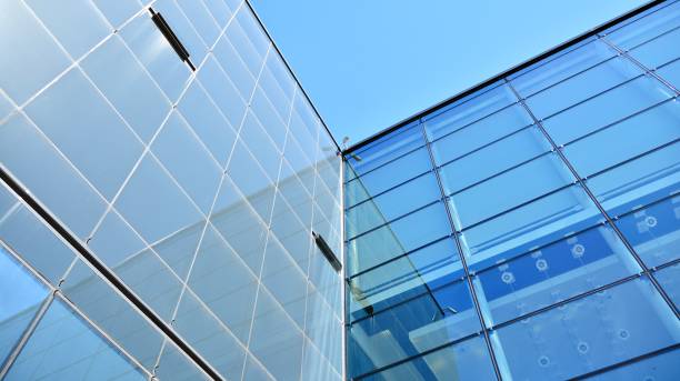 istock Abstract image of looking up at modern glass and concrete building. 1278363552