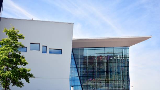 istock Abstract image of looking up at modern glass and concrete building. 1278363555