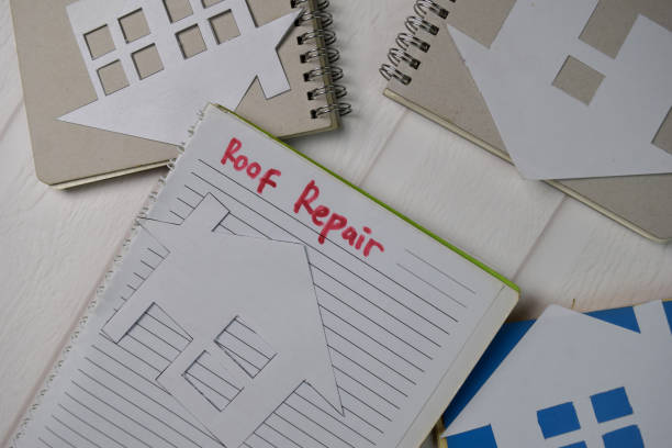 istock Roof Repair text write on a book isolated wooden table. 1278365468