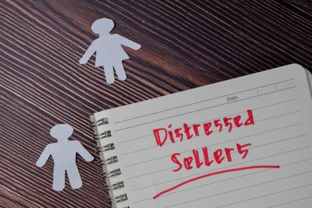 Distressed Sellers text write on a book isolated wooden table.