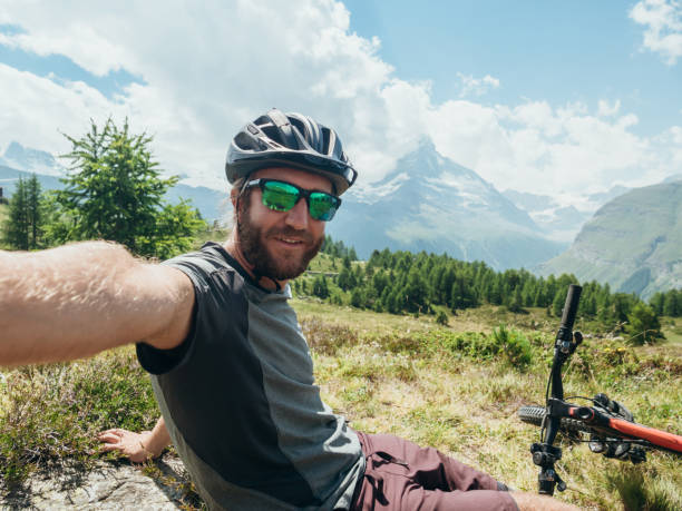 istock Mountain biker takes selfie with Matterhorn mountain 1278367050