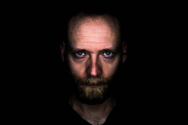 Headshot of man winking.