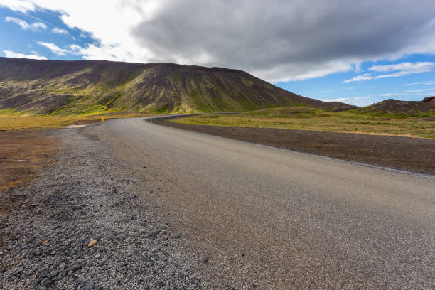istock Typical Icelandic landscape with asphalt road, Iceland. 1278378362