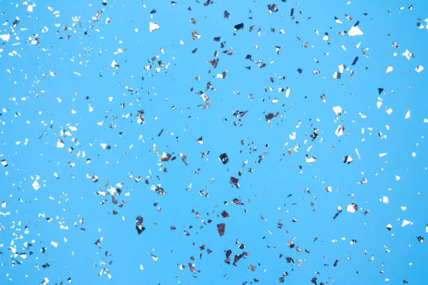 istock Festive blue background with holographic flying silver sparkles for your project. Holiday backdrop with copyspace. Birthday party, Christmas or New Year celebration concept 1278379247