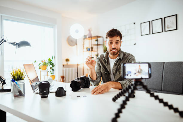 istock Vlogger examining memory cards for cameras 1278379304
