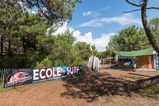 Le Porge, France. 08-16-2020: The small seaside resort of Le Porge, near Lacanau on the French Atlantic coast, has a surf school near the beach called 'Le Gressier'
