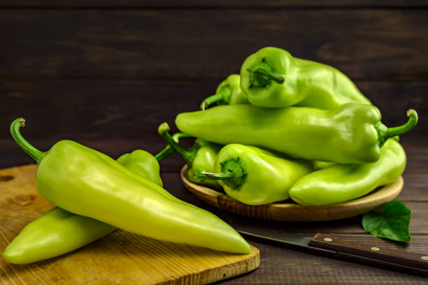 istock Fresh green peppers on a wooden table 1278384203