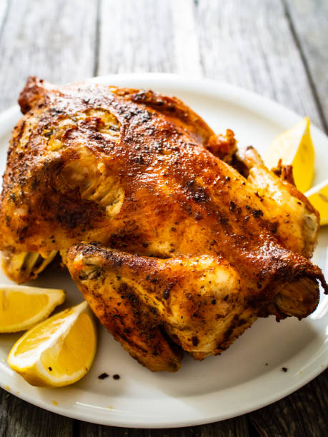 istock Roast chicken on wooden table 1278388295