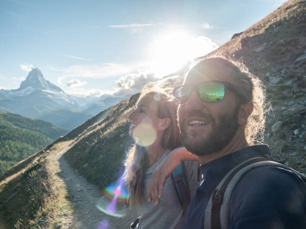 istock Couple hike in the Swiss Alps 1278393621