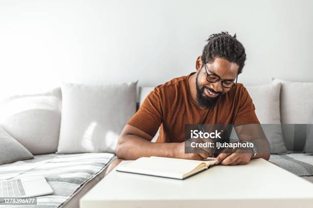 Control Your Budget Before It Controls You Stock Photo - Download Image Now - Writing - Activity, Men, Diary