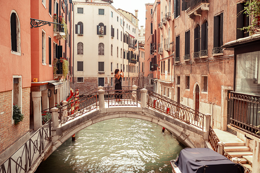 Venice, Italy - September 23, 2019: Panoramic view of the Grand Canal with gondolas and the Rialto Bridge (Ponte di Rialto). Venice, Italy.