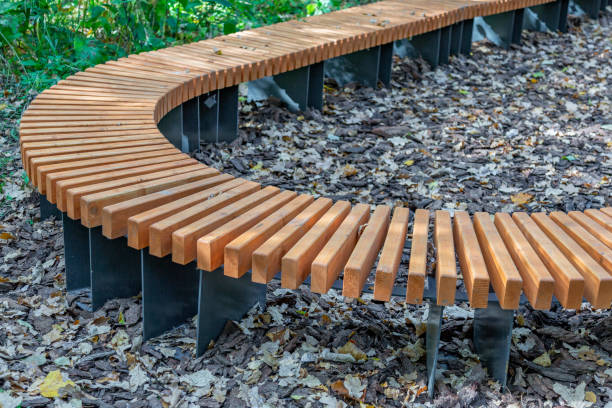 istock Comfortable wooden bench in the city park 1278400102